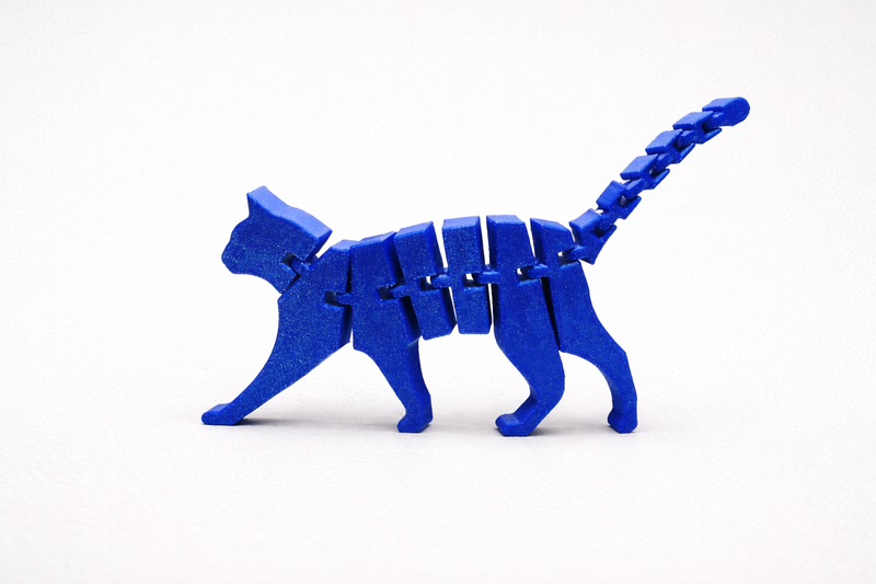 Flexi articulated 3D printed cat figure with moving joints, 13cm wide