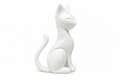 White sitting cat figurine with pointed ears and a curled tail